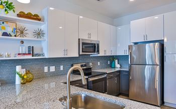 Modern kitchen with glass backsplash 